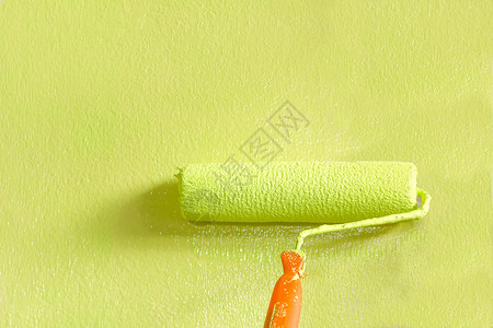 油漆墙壁滚刷工作绿色维修艺术活力艺术家画家画笔滚筒背景图片