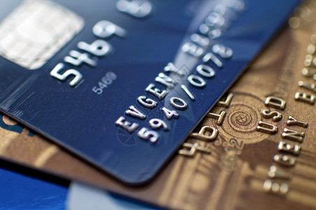 信用卡货币焦点银行业商业零售黄色蓝色塑料信用金融背景图片