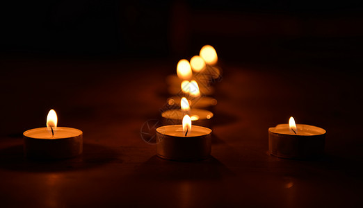 蜡烛生日反光茶色假期火焰灯芯背景图片