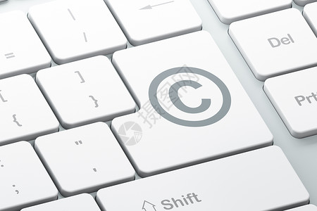 法律概念 在计算机键盘背景上版权执法数据保卫分子贸易商标知识白色保险执照背景图片