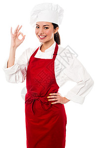 哇 好美味又完美服务商面包师女士职员餐饮职业手指商业微笑快乐背景图片