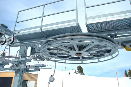 滑雪升降机工作车轮技术拖拉机机器金属酒吧背景图片