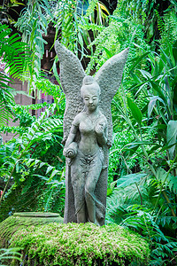 仙女花园花园中的仙女雕像背景