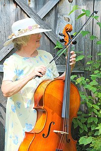 女大提琴手成人闲暇职业演员字符串音乐家大提琴乐器老师音乐背景图片