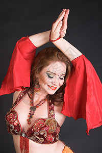肚皮舞素材红色的贝贝舞者黑发胸衣姿势娱乐艺术家细绳亮片肚皮化妆品戏服背景