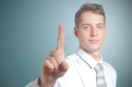 商务人士按假想的按钮商业商务男人人士手指展示男性技术背景图片