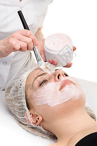 应用的面部剥皮面罩治疗皮肤面具奶油女孩美容师护理黏土水疗化妆品健康高清图片素材