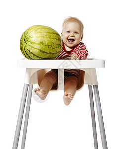 小婴儿和西瓜宝宝西瓜和婴儿西瓜椅子午餐条纹食物晚餐金发女郎童年影棚女儿身体背景