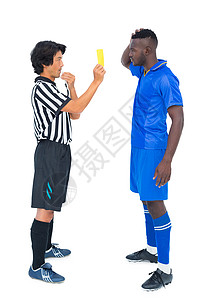 向足球运动员出示黄卡的裁判员齿轮力量体育蓝色团队权威球衣黄牌官员警告播放器高清图片素材