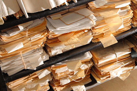 归档中的纸张文档组织数据图书馆命令档案工作学习文件夹办公室贮存文书工作高清图片素材