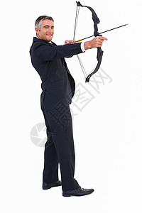 笑笑的商务人士鞠躬套装男人射箭领带人士快乐微笑商务职业公司背景图片