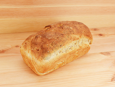 新鲜烘烤的燕麦和菜籽面包背景图片