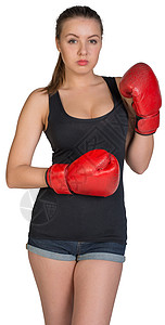 戴拳击手套的妇女长发衬衫长度短裤运动装冒充姿势照片围巾牛仔裤背景图片