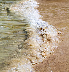 河中金子的提陆汉湾抽象自由阳光气泡热带石头海滩海浪小岛阴影旅游背景图片