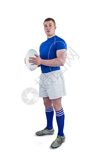 持有橄榄球的橄榄球运动员播放器运动男人竞技球衣竞赛蓝色双手体育红发背景图片