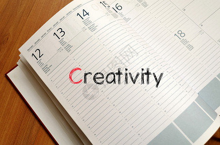 笔记本上的创造性文本概念力量灯泡团队商业设计师职业创造力办公室教育会议背景图片