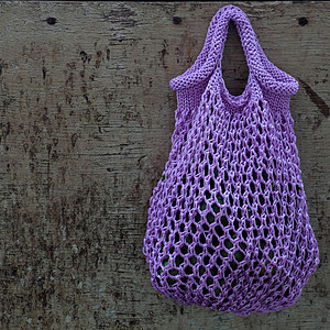 挂断yar 针织手工手提包展示妈妈织物紫色女士纺织品纤维背景市场编织背景