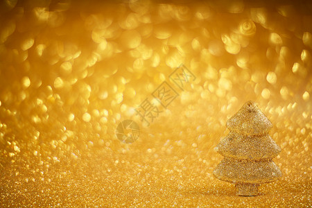 金色圣诞杉树庆典金子云杉装饰黄色卡片松树装饰品辉光风格背景图片