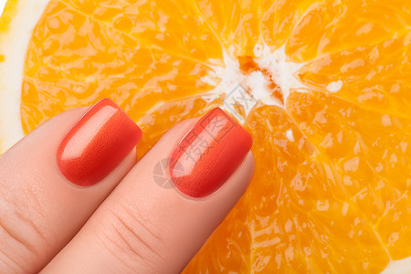 橙色指甲油创造力广告美学手指指甲凝胶背景图片