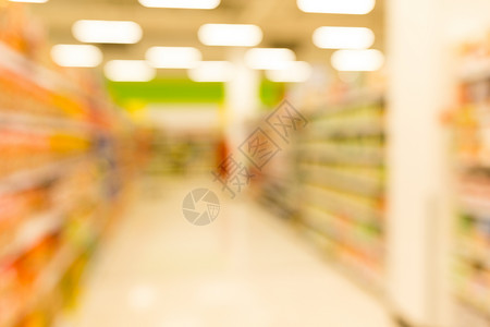 超市商店的模糊视图架子消费者产品零售部门商业商品杂货店店铺食物光高清图片素材
