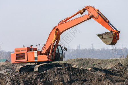 挖掘机地球天空工作红色商业工程师建筑海军力量电铲高清图片