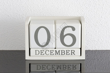 12月6日和11日的白区块日历日期框架历史死亡会议反射假期节日白色黑色派对背景图片