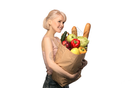 拥有杂货购物袋的妇女白色购物胡椒蔬菜面包微笑营养零售女性顾客背景