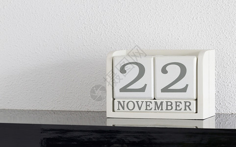 11月22日和11月目前白区块日历日期框架派对会议反射节日死亡白色黑色假期历史背景图片