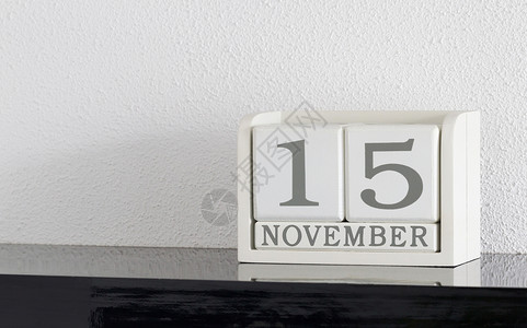 11月15日和11月目前白区块日历日期框架死亡假期会议派对历史反射黑色白色节日背景图片