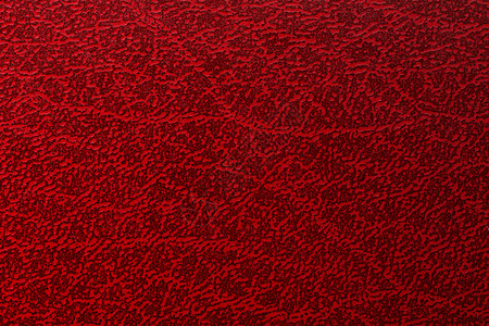衣服上的图案旧红色皮革板材抽象背景上的脏质地背景