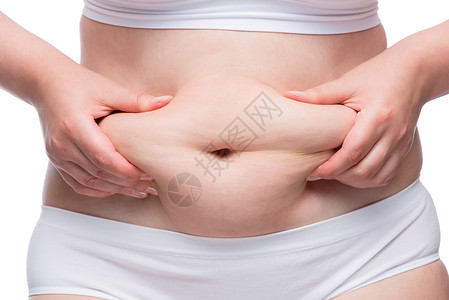 女人的手在胖肚子上折叠脂肪 紧紧地射入下面高清图片