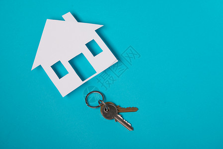 带有房屋图形的银键房子投资家庭保险经纪人合同钥匙安全财产抵押背景图片