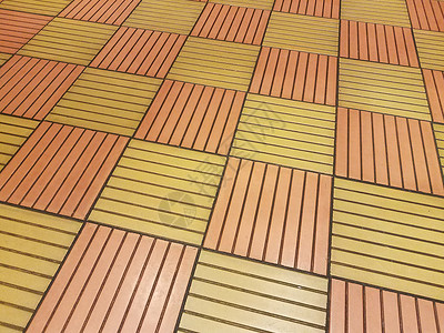 地板上橙色和黄色平方瓷砖地面正方形镶嵌背景图片