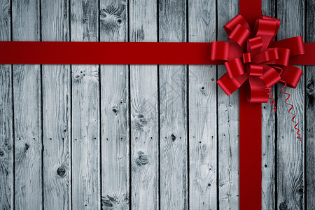 红色圣诞礼章和丝带的复合图像木板木头时候展示假期礼物绘图灰色庆典计算机背景图片