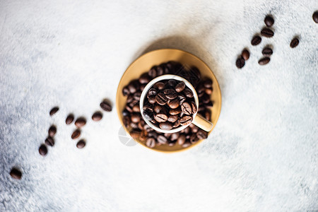 咖啡豆概念桌子制品乡村食物陶瓷平铺石头杯子咖啡背景图片