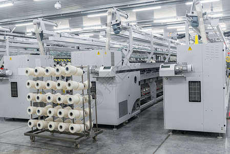 一家纺织厂的线条生产机械织物设施编织丝绸作坊纤维纺纱制造业羊毛看法高清图片素材