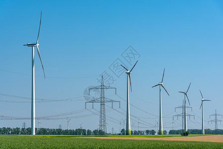 传输线和天空高管电线和风力涡轮机电缆农场引擎环境技术风车天空电源线资源风能背景