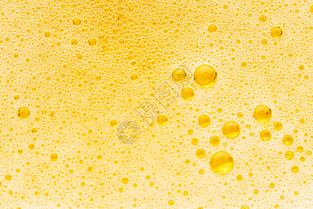 淡抹依稀醉淡啤酒中气泡的质地酒吧泡沫啤酒反射饮料橙子气体泡泡酒精宏观背景