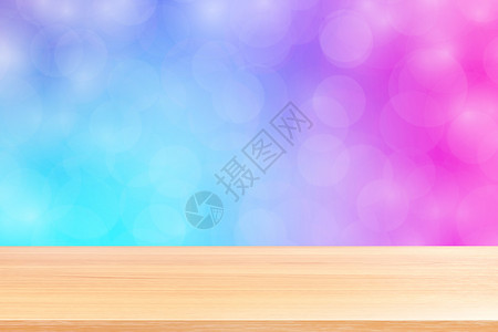空木桌地板在模糊的散景柔和紫色渐变背景上 木板空在紫色散景彩色光罩上 彩色散景灯渐变软 用于横幅广告产品金子彩虹桌面橙子展示坡度背景