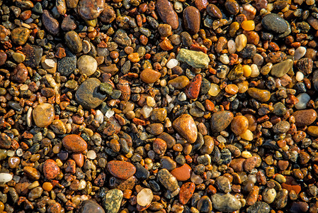 沙滩上的石头海洋卵石曲线岩石宏观矿物圆形材料高清图片