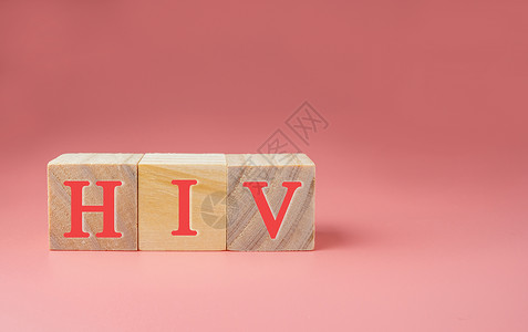 AIDS/HIV单词在木制立方 AIDS/HIV概念上关心高清图片素材