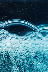 抽象液体肥皂泡泡蓝色背景冲洗粒子反射墙纸肥皂泡凝胶洗发水淋浴打扫清洁背景图片