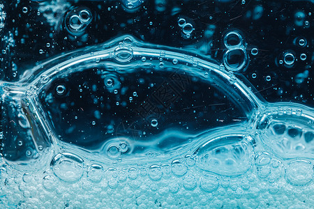 抽象液体肥皂泡泡蓝色背景温泉方法凝胶洗发水冲洗民众清洁粒子洗澡宏观背景图片