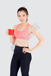 锻炼后喝白酒的运动中美丽的年轻年青女子饮食训练咖啡数字成人身体女士健身房女孩女性背景图片