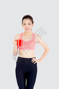 锻炼后喝白酒的运动中美丽的年轻年青女子身体健身房成人饮食咖啡女士女性数字营养训练背景图片