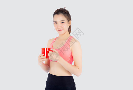 锻炼后喝白酒的运动中美丽的年轻年青女子身体健身房数字女性营养女孩训练咖啡女士饮食背景图片