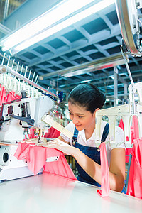 印度尼西亚亚洲纺织厂的服装裁缝公司织物生产女士工人劳动机器工业体积职业下水道质量高清图片素材