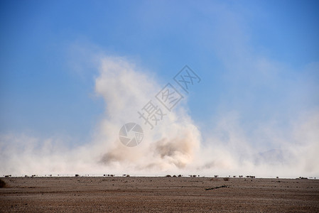 沙沙风暴沙漠天空灰尘死亡蓝色天气背景图片