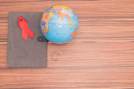 红丝带象征着世界健康日帮助活动药品红色医疗机构生活背景图片