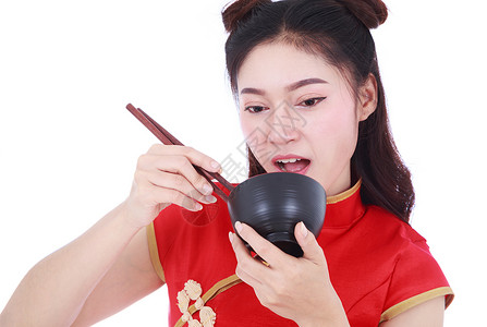 妇女穿着中国青桑服装 用筷子和碗叉成白种面的黑衣女子女孩文化传统美食女性女士快乐旗袍微笑裙子背景图片